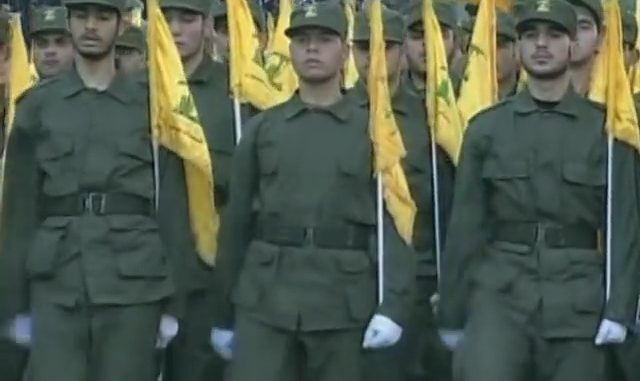 Hezbollah. Photo by Voice of America - YouTube: https://www.youtube.com/watch?v=gnjWMsXGNrs – View/save archived versions on archive.org and archive.today, Public Domain, https://commons.wikimedia.org/w/index.php?curid=65046088