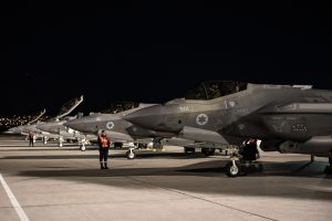 Israeli Air Force members wait for F-35I Adirs to launch for a Red Flag-Nellis 23-2 mission at Nellis Air Force Base, Nevada, March 16, 2023. Photo by Airman 1st Class Trevor Bell - https://www.dvidshub.net/image/7698029/f-35i-adir-red-flag, Public Domain, https://commons.wikimedia.org/w/index.php?curid=130153780