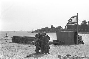 Six Day War. An Israeli troop carrier on the east bank of the Suez Canal opposite Ismailia. By Government Press Office (Israel), CC BY-SA 4.0, https://commons.wikimedia.org/w/index.php?curid=59600158