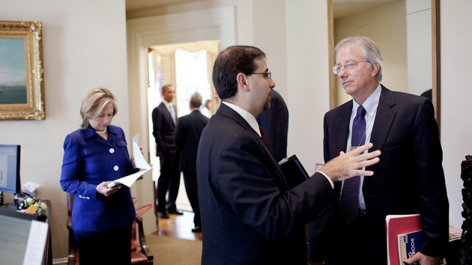 Dennis Ross, senior director for the Central Region, and Dan Shapiro, NSC senior director for the Middle East, center, confer in the Outer Oval as Secretary of State Hillary Rodham Clinton stands behind them at left, Sept. 1, 2010. Photo by Pete Souza - P090110PS-0047, Public Domain, https://commons.wikimedia.org/w/index.php?curid=51870037