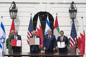 President Donald J. Trump, Minister of Foreign Affairs of Bahrain Dr. Abdullatif bin Rashid Al-Zayani, Israeli Prime Minister Benjamin Netanyahu and Minister of Foreign Affairs for the United Arab Emirates Abdullah bin Zayed Al Nahyan signs the Abraham Accords Tuesday, Sept. 15, 2020, on the South Lawn of the White House. Photo bBy The White House from Washington, DC - President Trump and The First Lady Participate in an Abraham Accords Signing Ceremony, Public Domain, https://commons.wikimedia.org/w/index.php?curid=94136660
