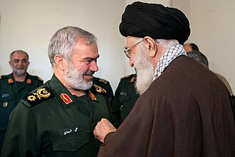 Ayatollah Seyyed Ali Khamenei Gives the Order of conquest to Brigadier General Ali Fadavi and four other commanders of the Islamic Revolutionary Guard who arrest American soldiers who attacked the Iranian borders in the Persian Gulf. By Khamenei.ir, CC BY 4.0, https://commons.wikimedia.org/w/index.php?curid=46818128