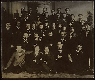  Herzl and the 'Democratic Fraction' at the Fifth Zionist Congress. A group photograph of Herzl with members of the Democratic faction of the Fifth Zionist Congress in Basel, 1901. The photograph shows, among others, Chaim Weizmann, Martin Buber, Berthold Feibel, Ephraim Moshe Lilin. Photo by Unknown author - National Library of Israel, Public Domain, https://commons.wikimedia.org/w/index.php?curid=80413836