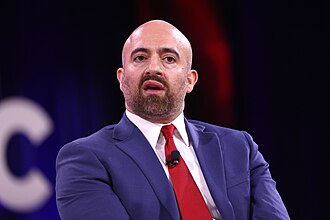 Mike Benz speaking at the 2025 Conservative Political Action Conference (CPAC) . Photo by Gage Skidmore from Surprise, AZ, United States of America - Mike Benz, CC BY-SA 2.0, https://commons.wikimedia.org/w/index.php?curid=160990427