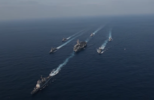 USS Gerald R. Ford With 7 Warships Deploying Toward Iran. February 14, 2026. Screengrab via Youtube https://www.youtube.com/watch?v=Qdk4U3MYWO4