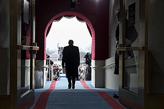 President-elect Donald Trump walks to take his seat for the inaugural swearing-in ceremony at the U.S. Capitol in Washington, D.C., Friday, January 20, 2017. (By Shealeah Craighead - President Trump's First 100 Days: 1, Public Domain, https://commons.wikimedia.org/w/index.php?curid=58421217)