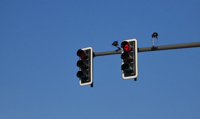 Photo by <a href="https://unsplash.com/@unkn0wncat?utm_source=unsplash&utm_medium=referral&utm_content=creditCopyText">Kevin Kandlbinder</a> on <a href="https://unsplash.com/photos/a-couple-of-traffic-lights-hanging-from-a-metal-pole-HsAJNGobIBw?utm_source=unsplash&utm_medium=referral&utm_content=creditCopyText">Unsplash</a> 