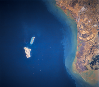 Kharg Island.  Photo by NASA - https://eol.jsc.nasa.gov/Collections/EarthFromSpace/photoinfo.pl?PHOTO=STS055-92-84, Public Domain, https://commons.wikimedia.org/w/index.php?curid=189053539