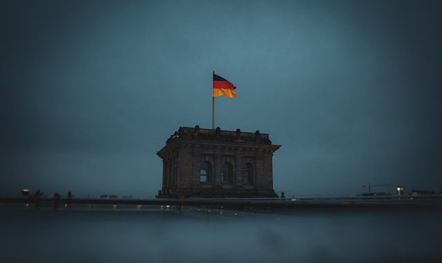 Photo by <a href="https://unsplash.com/@christianlue?utm_source=unsplash&utm_medium=referral&utm_content=creditCopyText">Christian Lue</a> on <a href="https://unsplash.com/photos/flag-of-us-a-on-top-of-building-G6RE_to6Lus?utm_source=unsplash&utm_medium=referral&utm_content=creditCopyText">Unsplash</a>
      