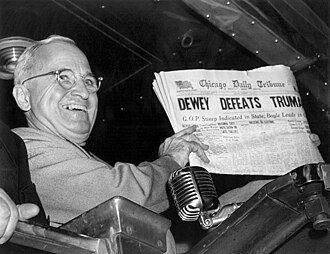 Harry S. Truman holding the Chicago Daily Tribune with the erroneous headline, "Dewey Defeats Truman", at Union Station in St. Louis, Missouri, on November 4, 1948, after winning the 1948 United States presidential election.  Photo by Byron H. Rollins - "A presidential election history lesson: Americans often waited days or weeks for the outcome", The Washington Post, November 4, 2020.  Originally distributed by the Associated Press and published in numerous newspapers on November 5, 1948., Public Domain, https://commons.wikimedia.org/w/index.php?curid=121758373