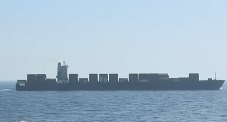 Tanker being guided thru Strait of Hormuz.  Screengrab via Youtube