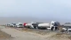 Line of trucks backed up due to damaged bridge in Iran.  Screengrab via X.