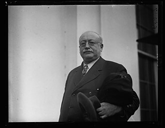  Victor Berger, Socialist Congressman of Wisconsin at White House. Photo by Harris & Ewing, photographer - Library of CongressCatalog: https://lccn.loc.gov/2016891838Image download: https://cdn.loc.gov/service/pnp/hec/42500/42592v.jpgOriginal url: https://www.loc.gov/pictures/item/2016891838/, Public Domain, https://commons.wikimedia.org/w/index.php?curid=67875417