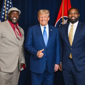 Larry Wilcoxson, left, poses with President Donald Trump and Rep. Byron Donalds. / Facebook