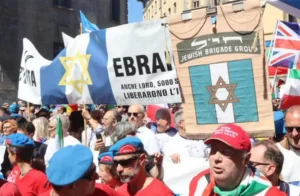The Jewish Brigade and members of the Milan Jewish community during a parade celebrating Italy's Liberation Day on April 25, 2026. (credit: SCREENSHOT/X/VIA SECTION 27A OF THE COPYRIGHT ACT)