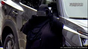 Jessica Bowie allegedly taking photographs near the New York State Capitol in preparation for a terrorist attack. (FBI/DOJ)