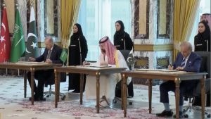 Signing of the Mecca Agreement by Erdogan, MBS, and Pakistani PM Shehbaz Sharif.  Screengrab via Youtube.