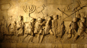 Modern replica of the Arch of Titus relief depicting the spoils of the Jerusalem Temple. By derivative work: Steerpike (talk)Arc_de_Triumph_copy.jpg: user: ??? ????? - Arc_de_Triumph_copy.jpg, Public Domain, https://commons.wikimedia.org/w/index.php?curid=4303855