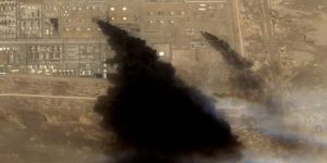 satellite image shows smoke rising from the Saudi Aramco distribution centre after suffering Houthi attack.  Screengrab via Youtube.
